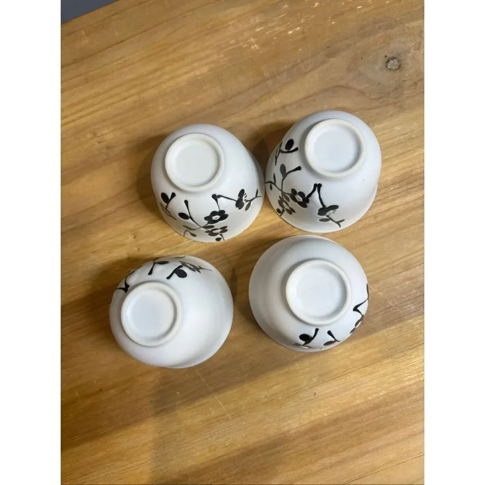 White ceramic tea pot and 4 tea cups with black cherry blossoms